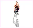 Custom platinum and 18K red gold peacock-shaped brooch with rubies, clear diamonds, amethysts, topazes.