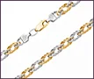 Custom chain in white and yellow gold with diamond-shaped links and engraved clasp.