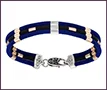 Men’s custom bracelet of three fabric cords with platinum and 14K red gold inserts.