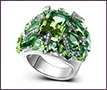 Custom white gold ring with fancy-cut peridots and diamonds.